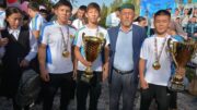 Көк туымызды көкте желбіреткен чемпиондар елге оралды